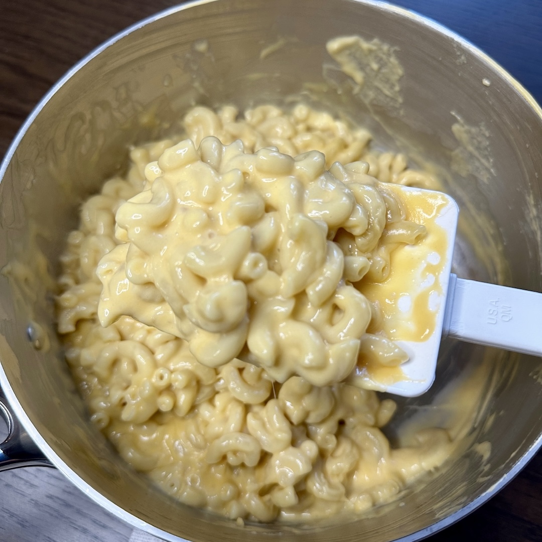 Close up shot of mac and cheese on a spoon