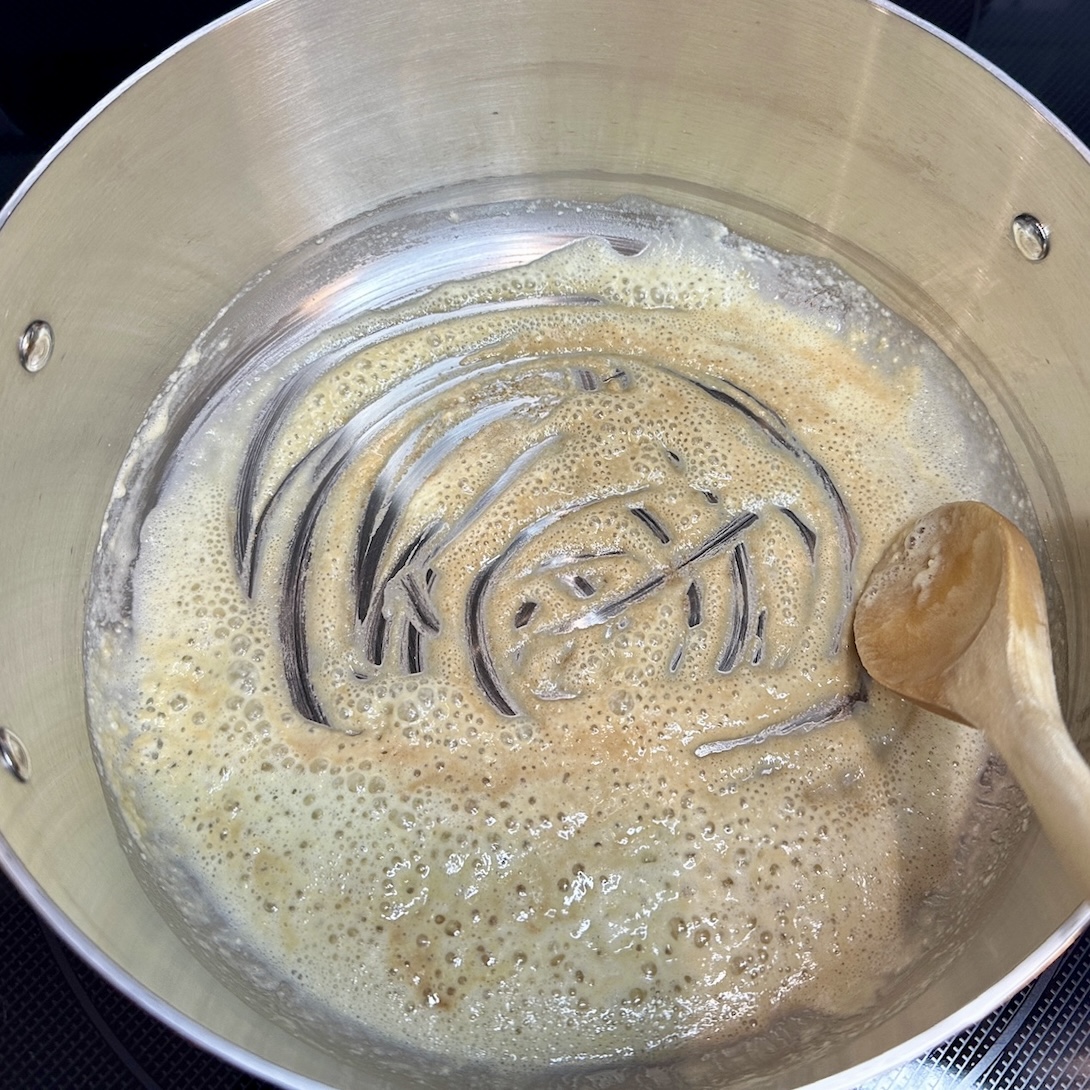 Cooking flour in the melted butter. Helps create a great roux.