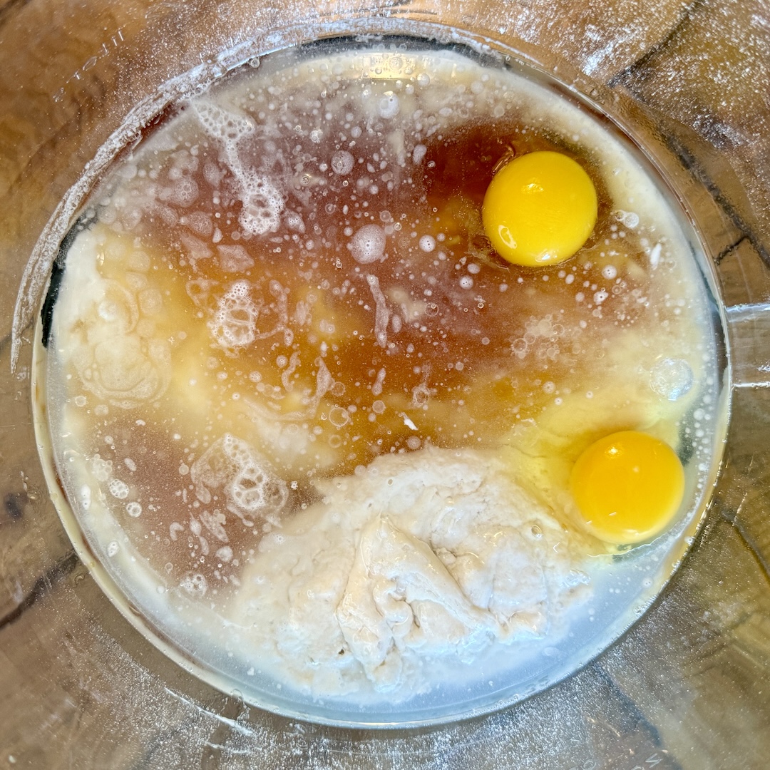 Ingredients in mixing bowl for cinnamon rolls