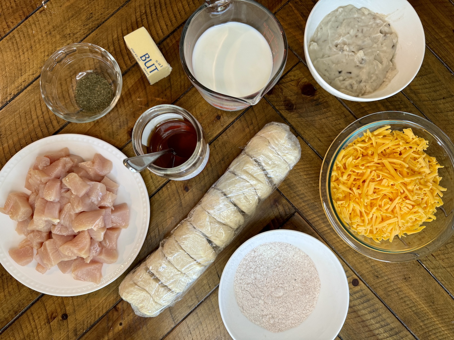 Ingredients to make honey chicken and biscuit casserole