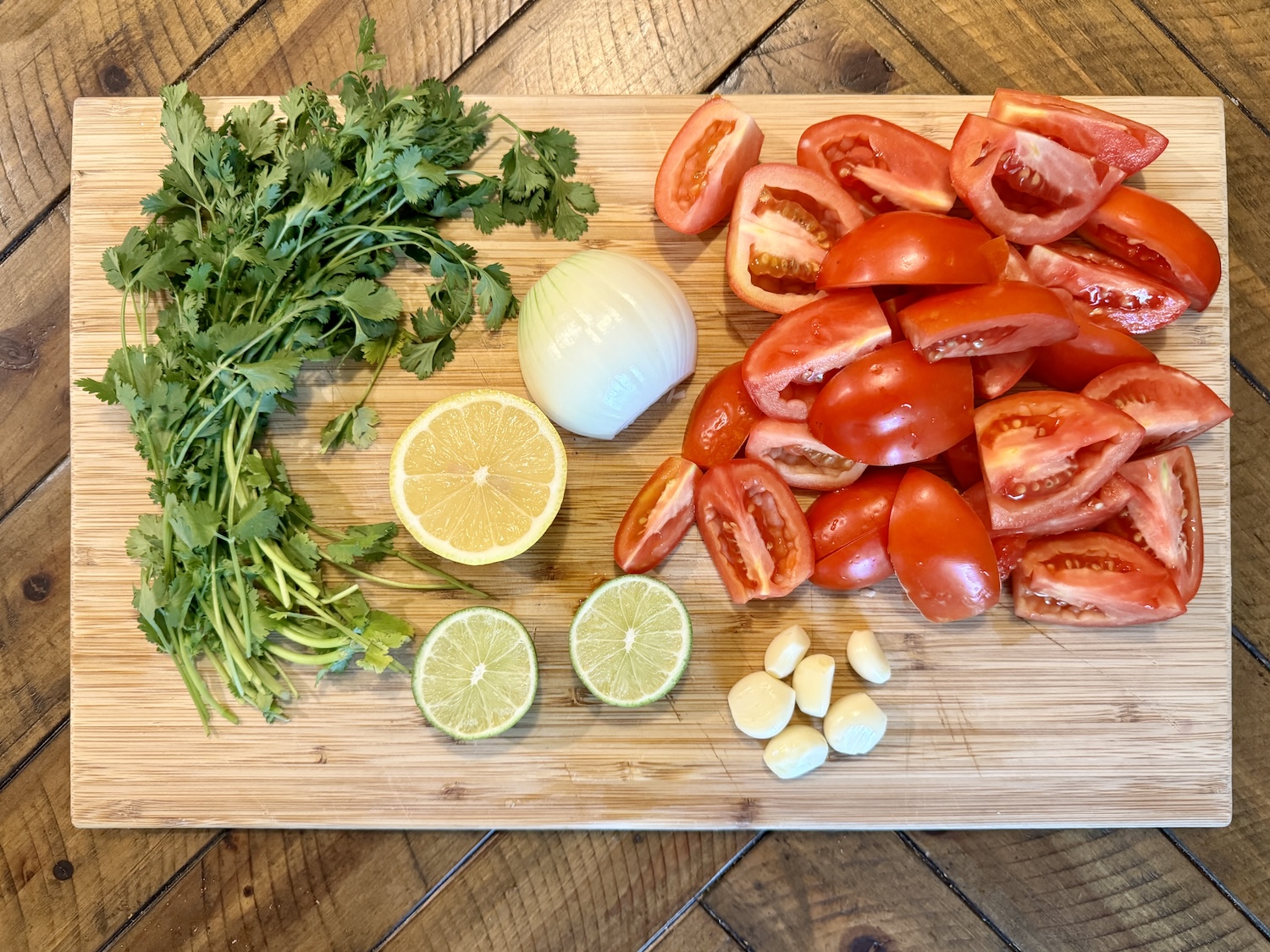 Salsa ingredients chopped on a cutting board.