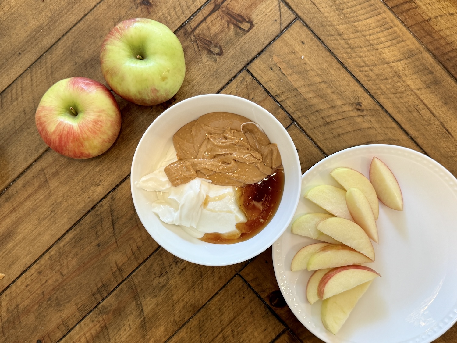 apple dip ingredients added to a bowl to be mixed