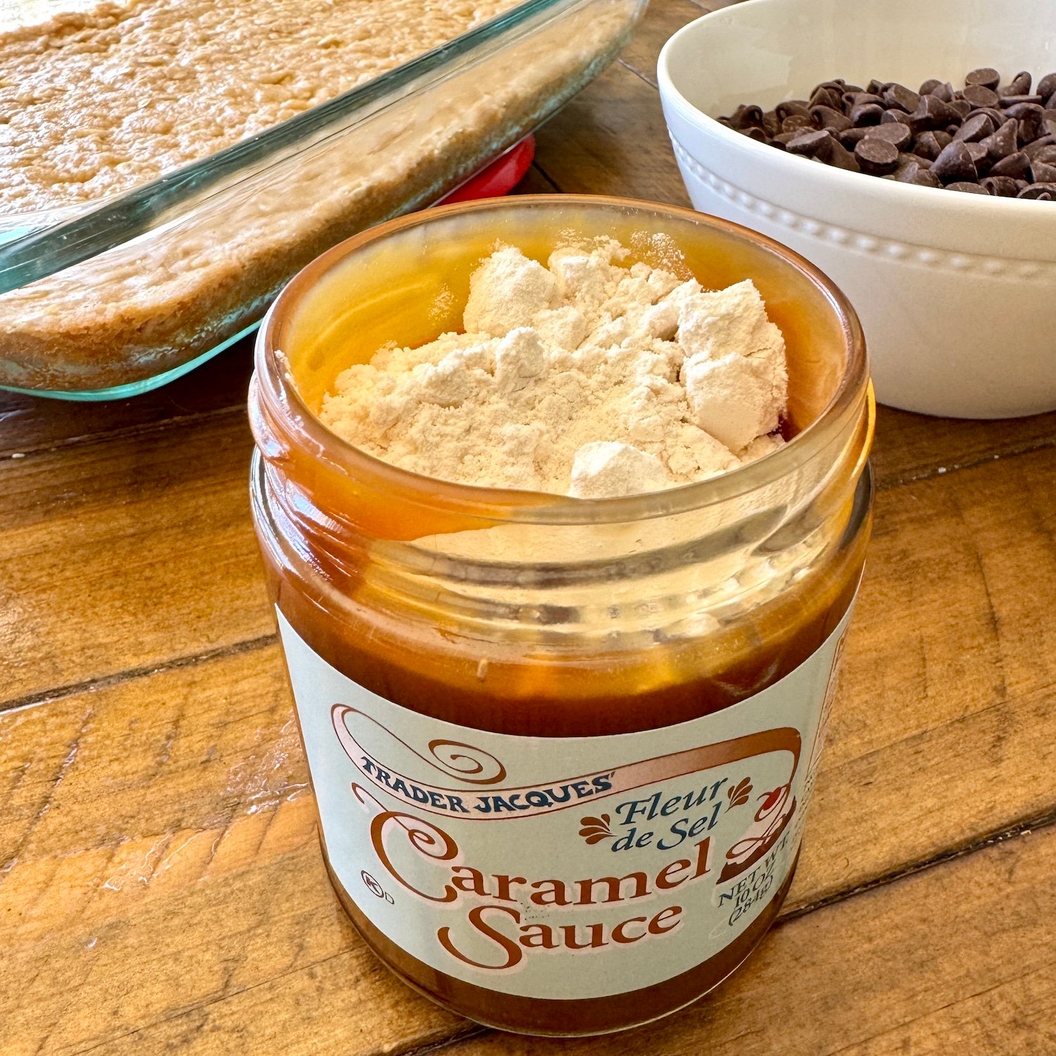 adding flour to caramel sauce